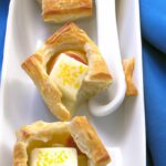 Delightful Quail Eggs Nestled in Flaky Puff Pastry Treats